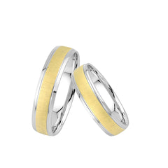 Central Trauringe Classics F504 – Zeitlose Eleganz in Weiß- und Gelbgold Die Central Trauringe Classics F504 aus der Classics Kollektion verkörpern schlichte Eleganz und zeitlose Schönheit durch die Kombination von Weißgold und Gelbgold.  Spezifikationen und Details: Gesamt-Carat: 0,000 ct. Standardbreite: 5,00 mm Standardhöhe: 1,00 mm Material: 375 Weißgold, 375 Gelbgold Diese Trauringe zeichnen sich durch ihr elegantes Design aus, das durch den Einsatz von 375 Weißgold und 375 Gelbgold besticht. Die harmo